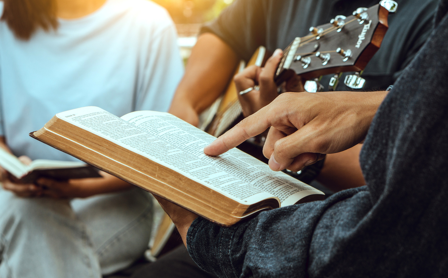 Group of people reading bible,praying and worship god.